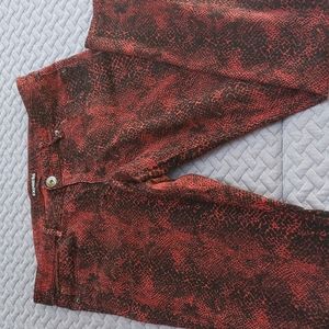 Express red snakeskin print skinny jeans